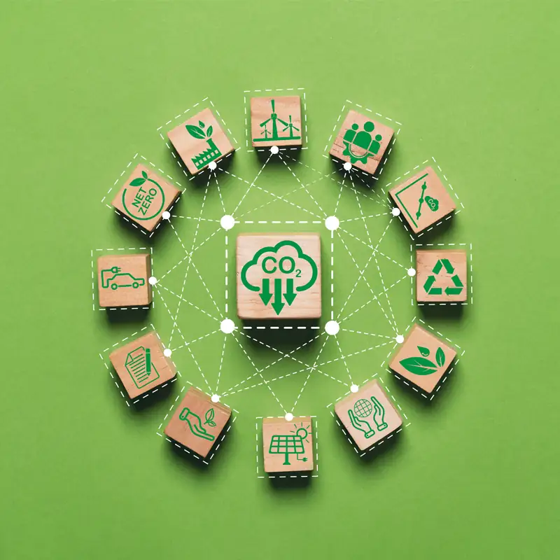 CO2 reduction icon connected with sustainability symbols on a green background