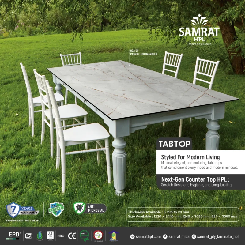 Caspio Lightmarbles Tabtop HPL dining table placed on a green lawn