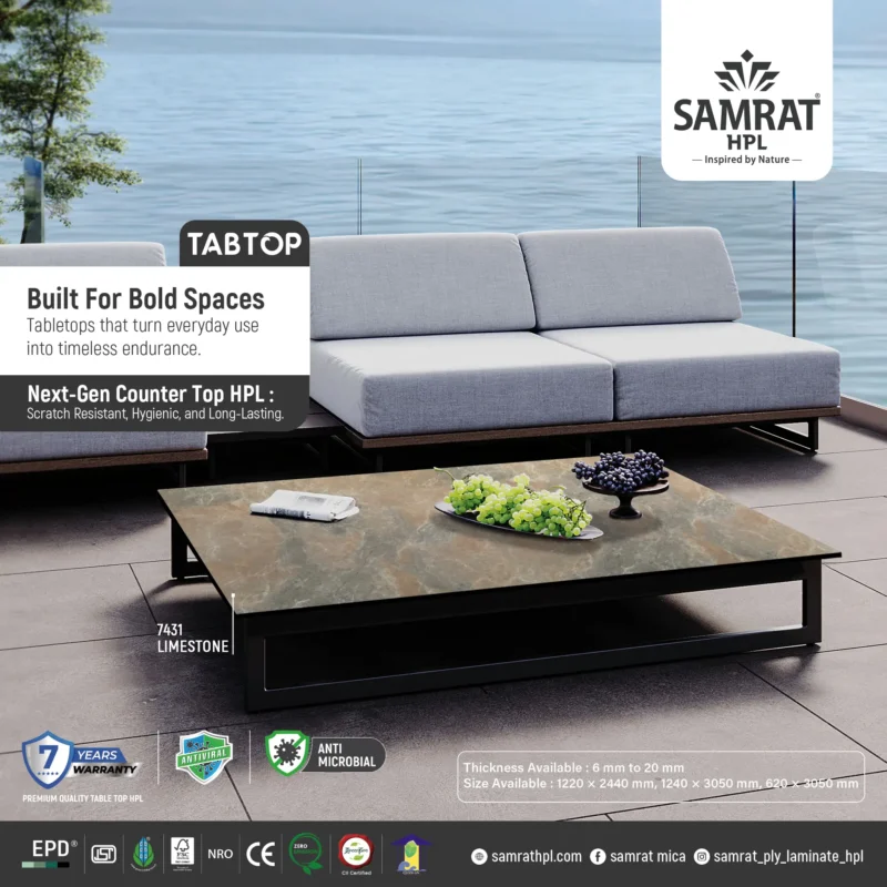 Limestone Tabtop HPL coffee table in an outdoor lounge beside water